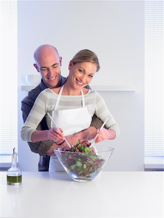 Couple Mixing Salad Stock Photo - Rights-Managed, Code: 700-01174124