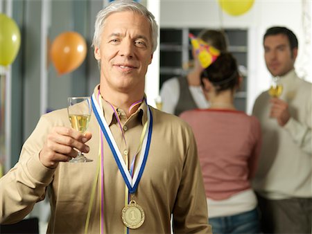 Portrait of Man Holding Wine Glass at Party Stock Photo - Rights-Managed, Code: 700-01173292