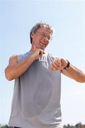 Man Checking Pulse Stock Photo - Rights-Managed, Code: 700-01173661