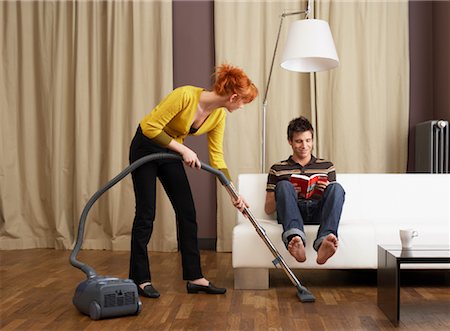 simsearch:700-00683334,k - Couple Vacuuming and Reading in Living Room Stock Photo - Rights-Managed, Code: 700-01185172