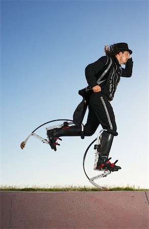 fleeing - Circus Performer on Stilts Stock Photo - Rights-Managed, Code: 700-01185230