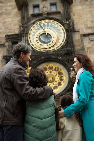 simsearch:632-05816381,k - Family Looking at Astronomical Clock Stock Photo - Rights-Managed, Code: 700-01185730