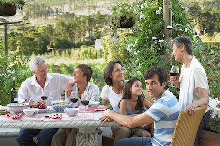 family dinner garden - Family Eating Outdoors Stock Photo - Rights-Managed, Code: 700-01195364