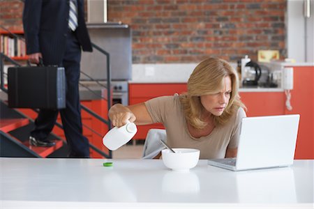 simsearch:700-00515127,k - Woman Using Laptop in Kitchen Stock Photo - Rights-Managed, Code: 700-01196643