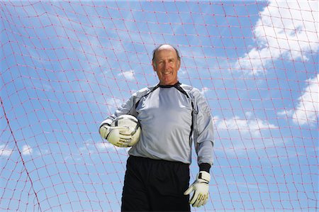 soccer player holding ball - Portrait of Soccer Goalie Stock Photo - Rights-Managed, Code: 700-01199287