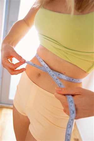 Woman Measuring Waist Stock Photo - Rights-Managed, Code: 700-01200072