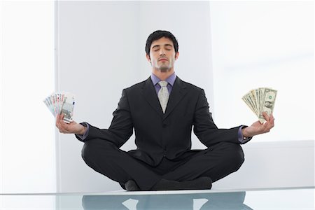 Businessman with American and European Currencies Meditating Stock Photo - Rights-Managed, Code: 700-01224055