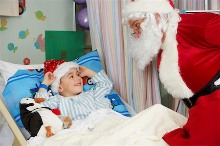 santa children - Santa Visiting Boy in Hospital Stock Photo - Rights-Managed, Code: 700-01224088