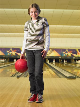 Girl at Bowling Alley Foto de stock - Con derechos protegidos, Código: 700-01223420