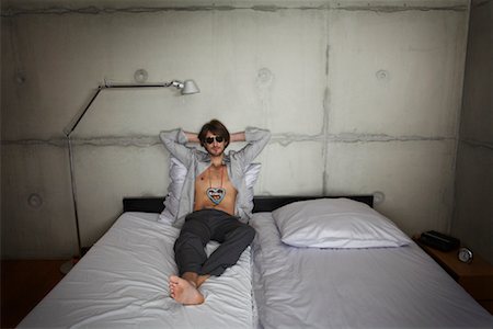 Man Lying on Bed Stock Photo - Rights-Managed, Code: 700-01223746