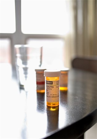 Pill Bottles on Table Stock Photo - Rights-Managed, Code: 700-01223935