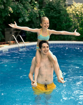 Father and Daughter in Swimming Pool Stock Photo - Rights-Managed, Code: 700-01234785