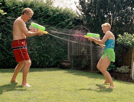 simsearch:700-01234773,k - Mature Couple Having Water Fight Stock Photo - Rights-Managed, Code: 700-01234781