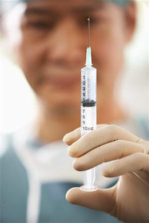 simsearch:614-00599645,k - Doctor Holding Needle Stock Photo - Rights-Managed, Code: 700-01234805