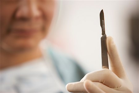 simsearch:700-01234802,k - Doctor Holding Scalpel Stock Photo - Rights-Managed, Code: 700-01234806