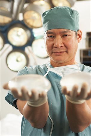 simsearch:700-01234802,k - Doctor Holding Implants Stock Photo - Rights-Managed, Code: 700-01234810