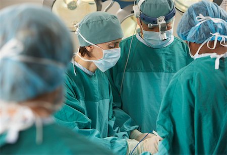 Doctors Performing Surgery Stock Photo - Rights-Managed, Code: 700-01234859