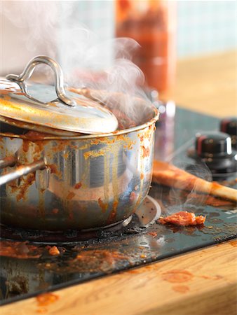 dirty and messy kitchen - Pot of Sauce Boiling Over on Stove Stock Photo - Rights-Managed, Code: 700-01235882