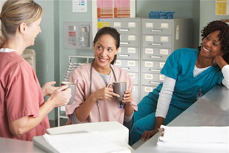Portrait of Medical Professionals At Nurse's Station Stock Photo - Rights-Managed, Code: 700-01236096