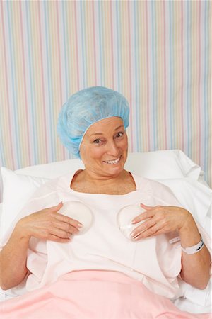 simsearch:700-01073337,k - Portrait of Woman Holding Breast Implants Stock Photo - Rights-Managed, Code: 700-01236124