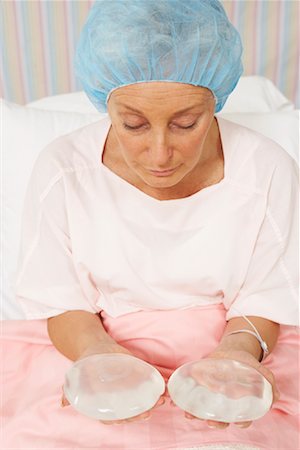 simsearch:700-01073337,k - Portrait of Woman Holding Breast Implants Stock Photo - Rights-Managed, Code: 700-01236125
