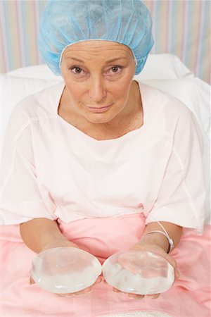 simsearch:700-01073337,k - Portrait of Woman Holding Breast Implants Stock Photo - Rights-Managed, Code: 700-01236126