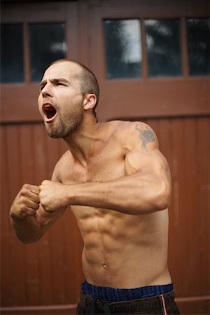 show off male - Man Flexing Muscles Stock Photo - Rights-Managed, Code: 700-01248810