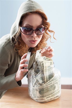 stealing (not forced entry) - Woman with Jar of Cash Stock Photo - Rights-Managed, Code: 700-01249280