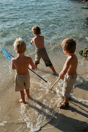 photos of little boy fishing - Boys Fishing Foto de stock - Con derechos protegidos, Código: 700-01260406