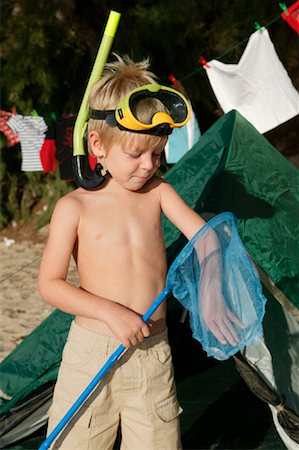 Boy at Campsite With Fishing Net Stock Photo - Rights-Managed, Code: 700-01260400