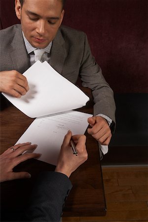 Businesswoman Signing Document Stock Photo - Rights-Managed, Code: 700-01275303