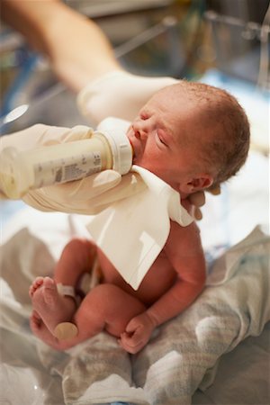 doctor with gloves with child - Newborn Baby Being Fed Stock Photo - Rights-Managed, Code: 700-01275338