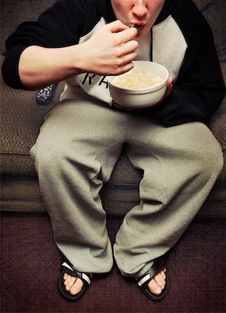 Teenaged Boy Eating Cereal Foto de stock - Con derechos protegidos, Código: 700-01275762