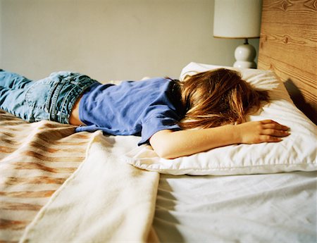 sulky tantrum - Girl Lying on Bed Stock Photo - Rights-Managed, Code: 700-01276090