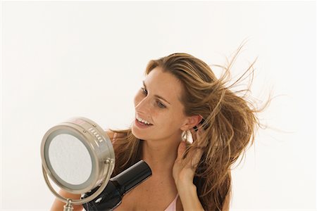 simsearch:600-01112551,k - Woman Blow Drying Hair Stock Photo - Rights-Managed, Code: 700-01276244