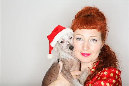 simsearch:600-02055834,k - Woman Holding Dog with Santa Hat Stock Photo - Rights-Managed, Code: 700-01344587