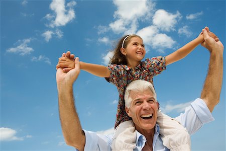 shoulder rides - Little Girl Sitting on Grandfather's Shoulders Stock Photo - Rights-Managed, Code: 700-01374744