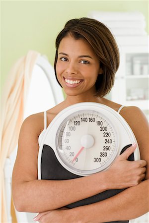 simsearch:600-02245725,k - Woman Holding Scale Stock Photo - Rights-Managed, Code: 700-01378649