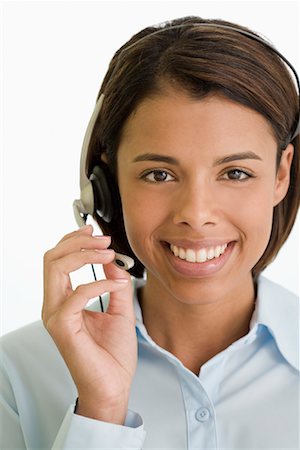 Femme à l'aide du casque téléphonique Photographie de stock - Rights-Managed, Code: 700-01378657