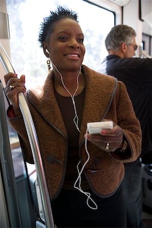 Woman with Mp3 Player on Subway Stock Photo - Rights-Managed, Code: 700-01380829