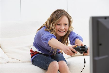 simsearch:6108-06905230,k - Girl Playing Video Games Stock Photo - Rights-Managed, Code: 700-01463722
