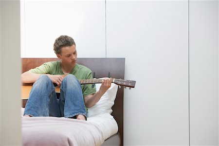 Teenage Boy Playing Guitar Stock Photo - Rights-Managed, Code: 700-01463748