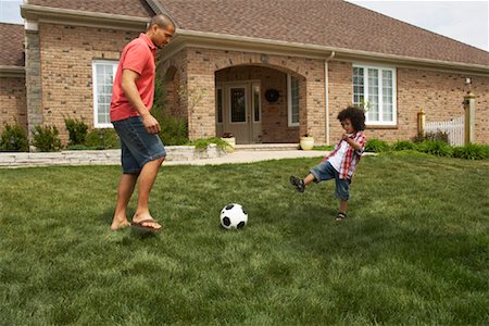 football in the backyard - Father and Son Playing Soccer Stock Photo - Rights-Managed, Code: 700-01494591
