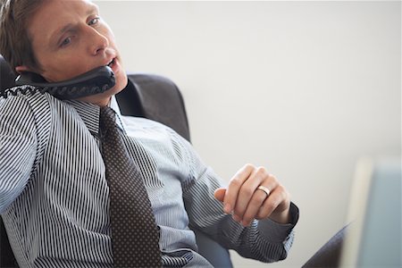 phone cord - Businessman Talking on Phone Stock Photo - Rights-Managed, Code: 700-01494649