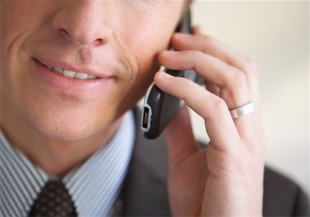 Close-up of Businessman Talking on Cell Phone Stock Photo - Rights-Managed, Code: 700-01494640