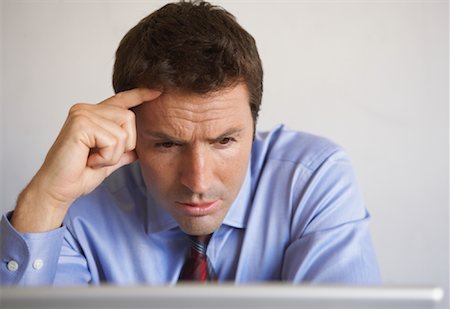 simsearch:700-00045560,k - Businessman Looking at Laptop Computer Stock Photo - Rights-Managed, Code: 700-01494715