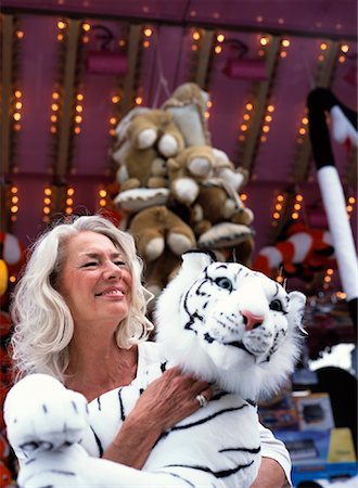 simsearch:700-02990047,k - Woman at Amusement Park, Holding Stuffed Animal Stock Photo - Rights-Managed, Code: 700-01539048