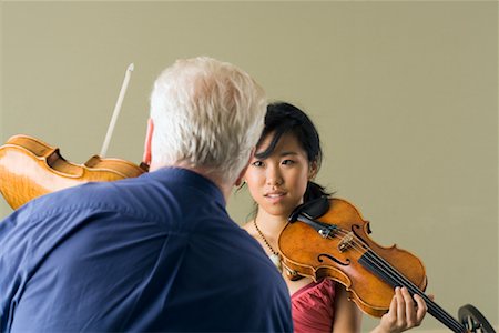 Girl Taking Violin Lesson Stock Photo - Rights-Managed, Code: 700-01540857