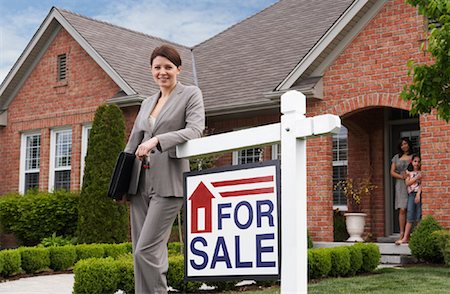 sold sign - Real Estate Agent by For Sale Sign Stock Photo - Rights-Managed, Code: 700-01571950