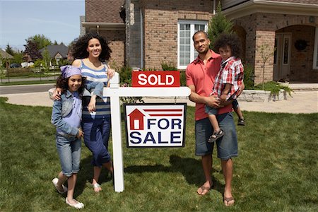 Portrait of Family by House with Sold Sign Stock Photo - Rights-Managed, Code: 700-01571973